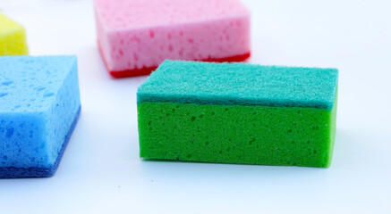 Cleaning kitchen dishwashing sponge on white background.