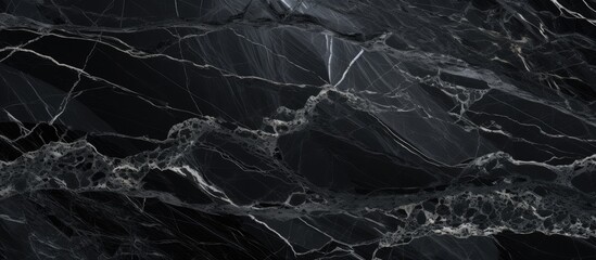 High-resolution black marble texture with a natural pattern for wallpaper and design artwork.