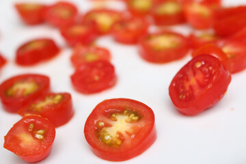 tomato background. tomatoes background. tomatoes on a plate. sliced ​​cherry tomatoes with selective focus.