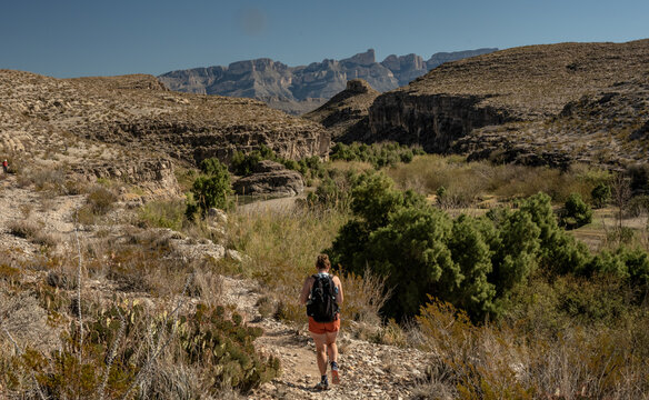 Woman Hikes Next To The Rio Grand Along The Hot Springs Trail