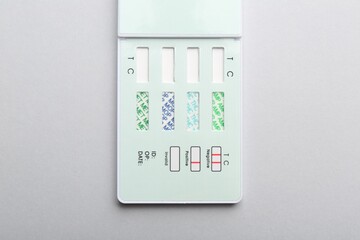 Multi-drug screen test on light grey background, top view
