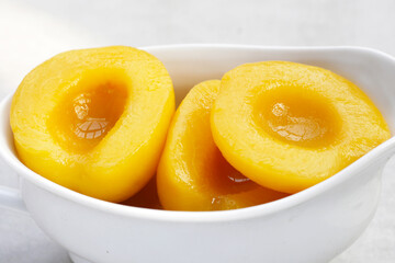 Peach halves in syrup. Fruity desserts
