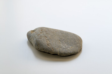 Fototapeta na wymiar 水切り遊びで使う薄い平らな石　余白あり