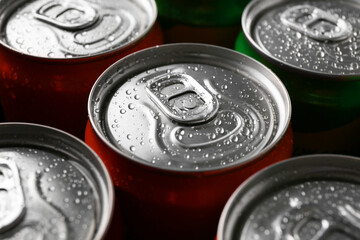 Energy drink in wet cans, closeup. Functional beverage