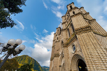 View from below of the facade of the Basilica of the Immaculate Conception in Jardin, Colombia