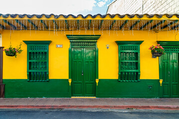 Facade of a colorful house in Jardin, Colombia