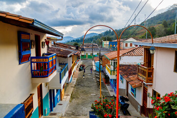Cobblestone street with colorful houses in Jerico, Colombia