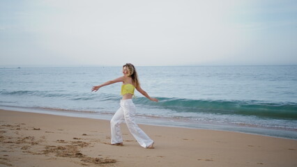 Talented artist moving body sensually performing contemporary choreography beach
