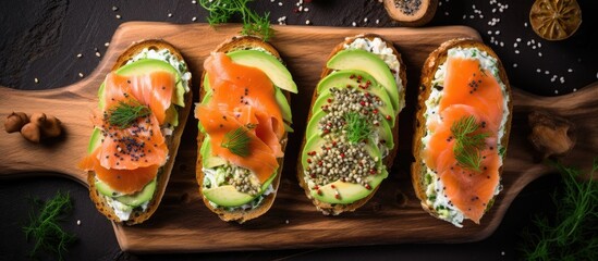 A wooden cutting board display of sandwiches featuring avocado and salmon, a perfect fusion of food ingredients for a delicious sushi dish - Powered by Adobe