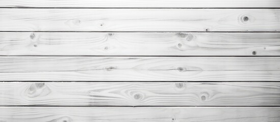 Obraz premium An artistic black and white photo showcasing a white wooden wall with parallel planks, highlighting the hardwood flooring and intricate wood stain pattern