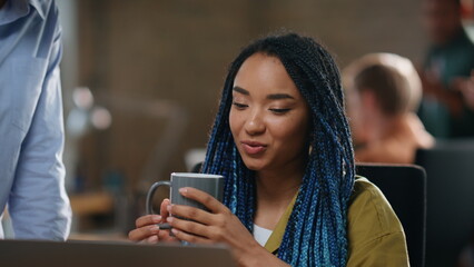 Girl employee greeting colleague sitting office closeup. Woman taking coffee cup