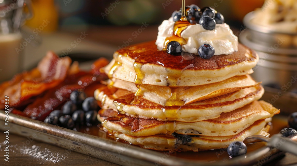 Poster a stack of fluffy pancakes topped with maple syrup whipped cream and fresh blueberries served alongs