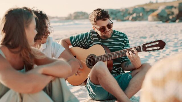Friends, picnic on beach and guitar outdoor, fun with singing at reunion and people have celebration. Summer, holiday with social gathering or hangout, friendship and party with instrument and music