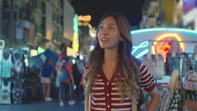 Asian young woman backpacker traveler traveling outdoors in the city. 