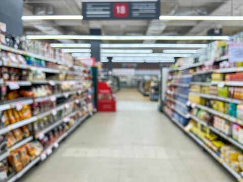 Supermarket aisle and shelves blurred background