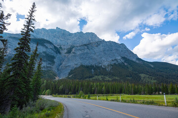 road between the mountains in Banff, Alberta, Canada