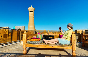 Woman tourist at cafe in Bukhara, Uzbekistan