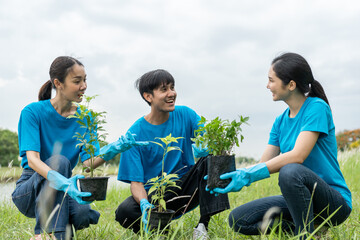 Volunteering Protection of environment and nature ecology concept. Group of volunteer plant a tree...