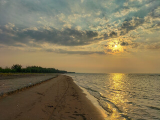 Beautiful view of sunset at a Cahaya Beach in Kendal, Central java, Indonesia.
