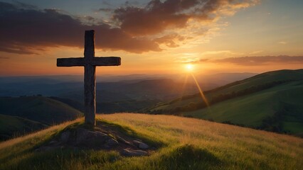 cross on the top of hill at sunset 