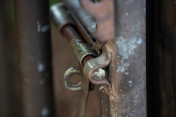 Old padlock on the iron door, closeup of photo.