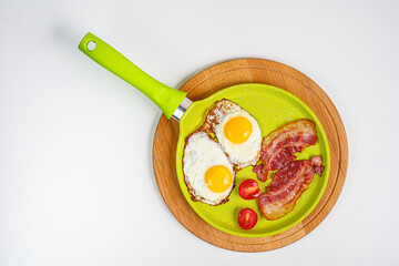 Fried eggs with bacon, tomatoes. Freshly squeezed juice