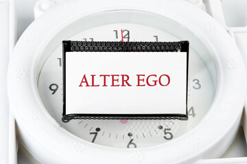 Text Alter ego is translated from Latin as the second self. a real or invented alternative personality of a person. Written on a white business card