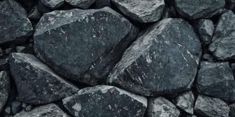Black white rock background. Dark gray stone texture. Mountain surface