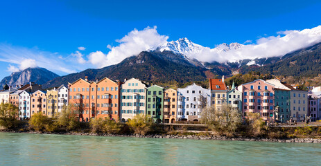 Panorama view of  Innsbruck  as city center town with beautiful houses, river Inn and Tyrol Alps, Austria