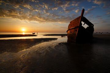 boat wreck at sunset