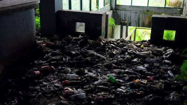 Heap Of Plastic Waste At Abandoned Hotel Pondok Indah Bedugul In Bali, Indonesia. high angle shot
