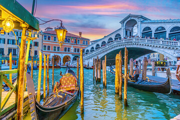 Panoramic view of famous Canal Grande with famous Rialto Bridge at sunset, Venice - 756933469