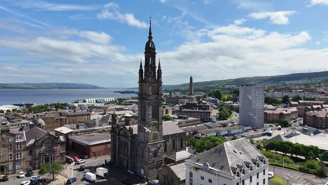 Greenock, Scotland UK. Aerial View of Birds Flying Above Former St George's North Church and Cityscape on Sunny Day