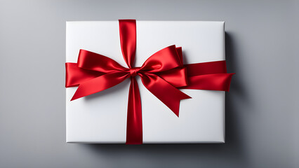 Gift tied with red ribbon on solid color background, holiday gift, space for text
