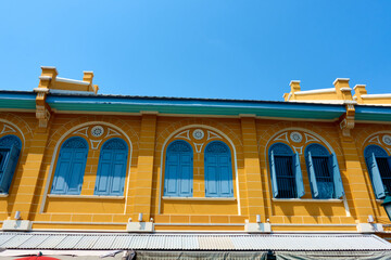 Brightly colored ancient buildings in colonial style in Bangkok, Thailand.