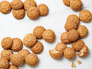pile of cookie amaretti on white marble background - traditional Italian Sardinian pastry....
