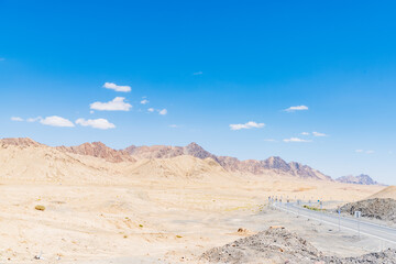 Fototapeta na wymiar The vast uninhabited land on the national highway from Xinjiang, China to Qinghai