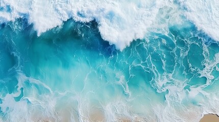 Aerial view capturing the turquoise hues of ocean water, with splashes and foam creating a captivating natural abstract texture.