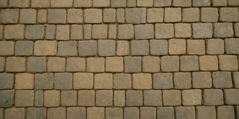 Paving stone pavement texture. Cobblestone pavement top view. Old stone sidewalk. Paving texture
