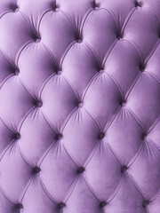 Purple quilted velour cloth abstract background, vertical orientation. Textile textures and...