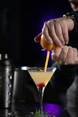Bartender Hands Piling Lemon for Ginger Apple Vermouth Cocktail - obrazy, fototapety, plakaty