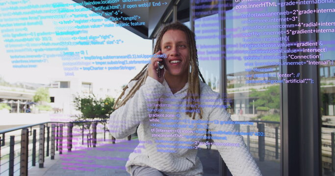 Image of data processing over biracial man using smartphone