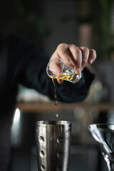 Bartender Pours Sweet Vermouth and Crafts Ginger Apple vermouth cocktail - obrazy, fototapety, plakaty