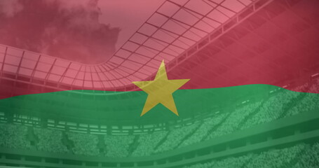 Fototapeta premium Image of flag of burkina faso over sports stadium