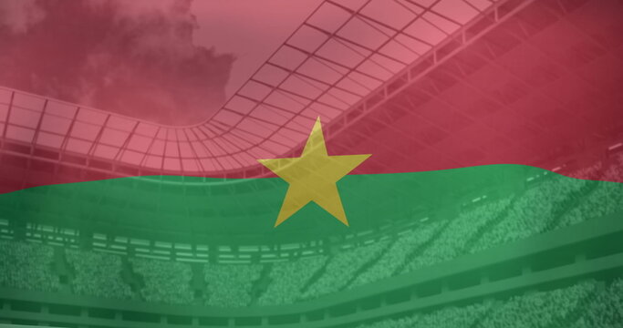 Naklejki Image of flag of burkina faso over sports stadium