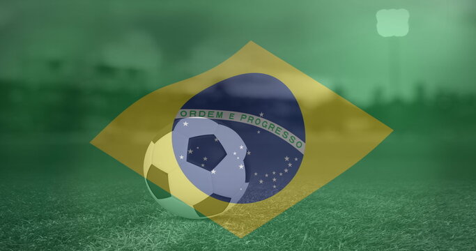 Naklejki Image of flag of brazil over football on stadium