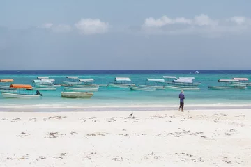 Zelfklevend Fotobehang Nungwi Strand, Tanzania Nungwi Beach and boats on the Indian Ocean waiting for tourists, Zanzibar near Jambiani