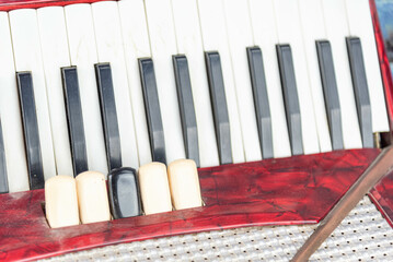 Old red piano accordion.