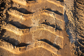 Vehicle tire tracks on the dirt road