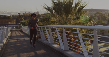 Image of media icons over african american man running